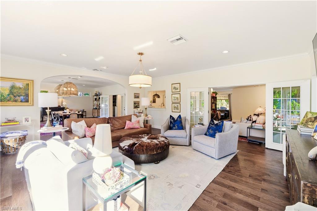 4630 11th Avenue Southwest Naples, FL 34116 - Photo 8 of 50 a living room with lots of furniture and view of kitchen