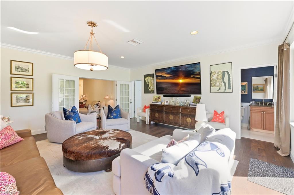 4630 11th Avenue Southwest Naples, FL 34116 - Photo 9 of 50 a living room with furniture and a flat screen tv