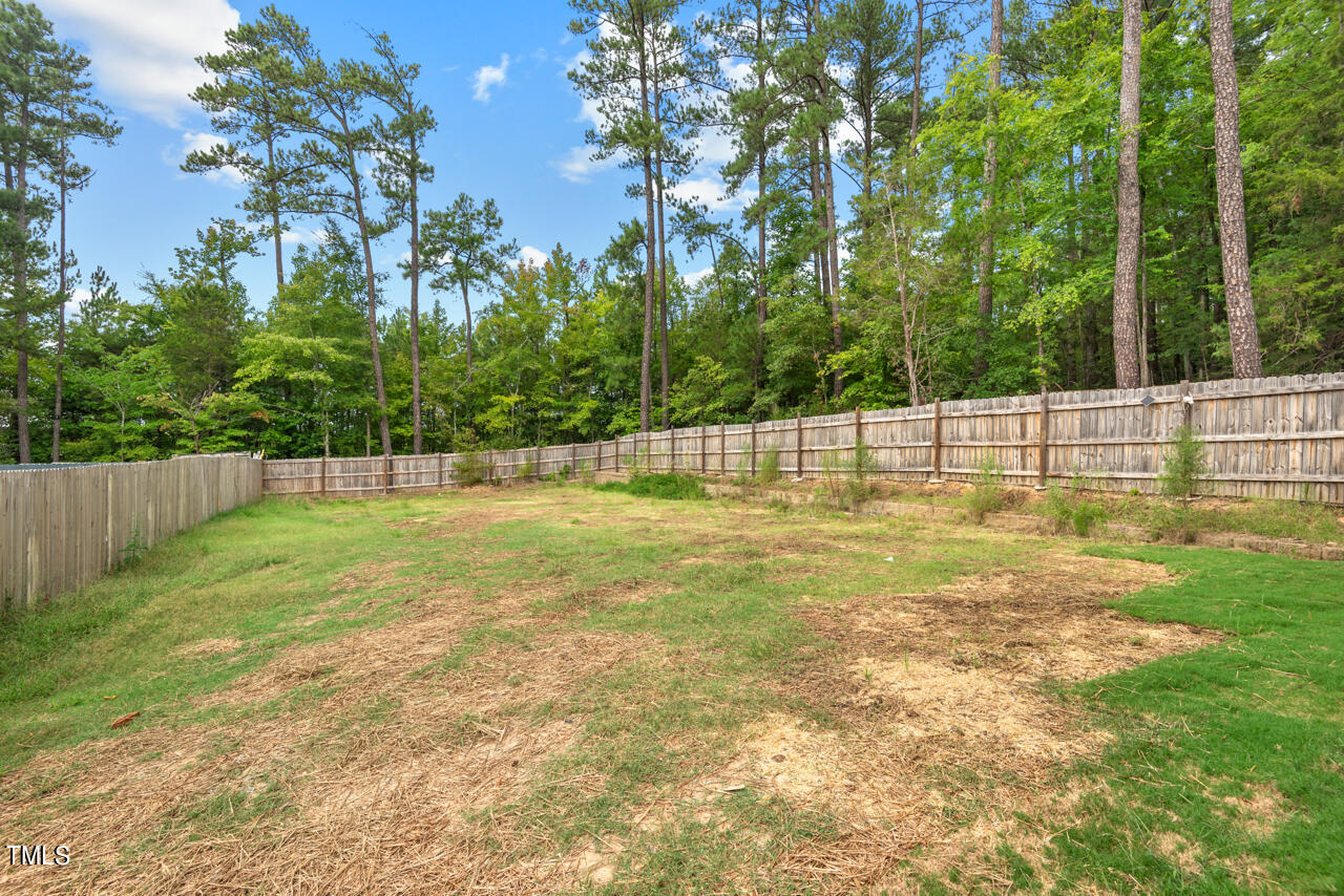 1010 Cook Road Durham, NC 27713 - Photo 53 of 64 The Expansive, Fenced Backyard