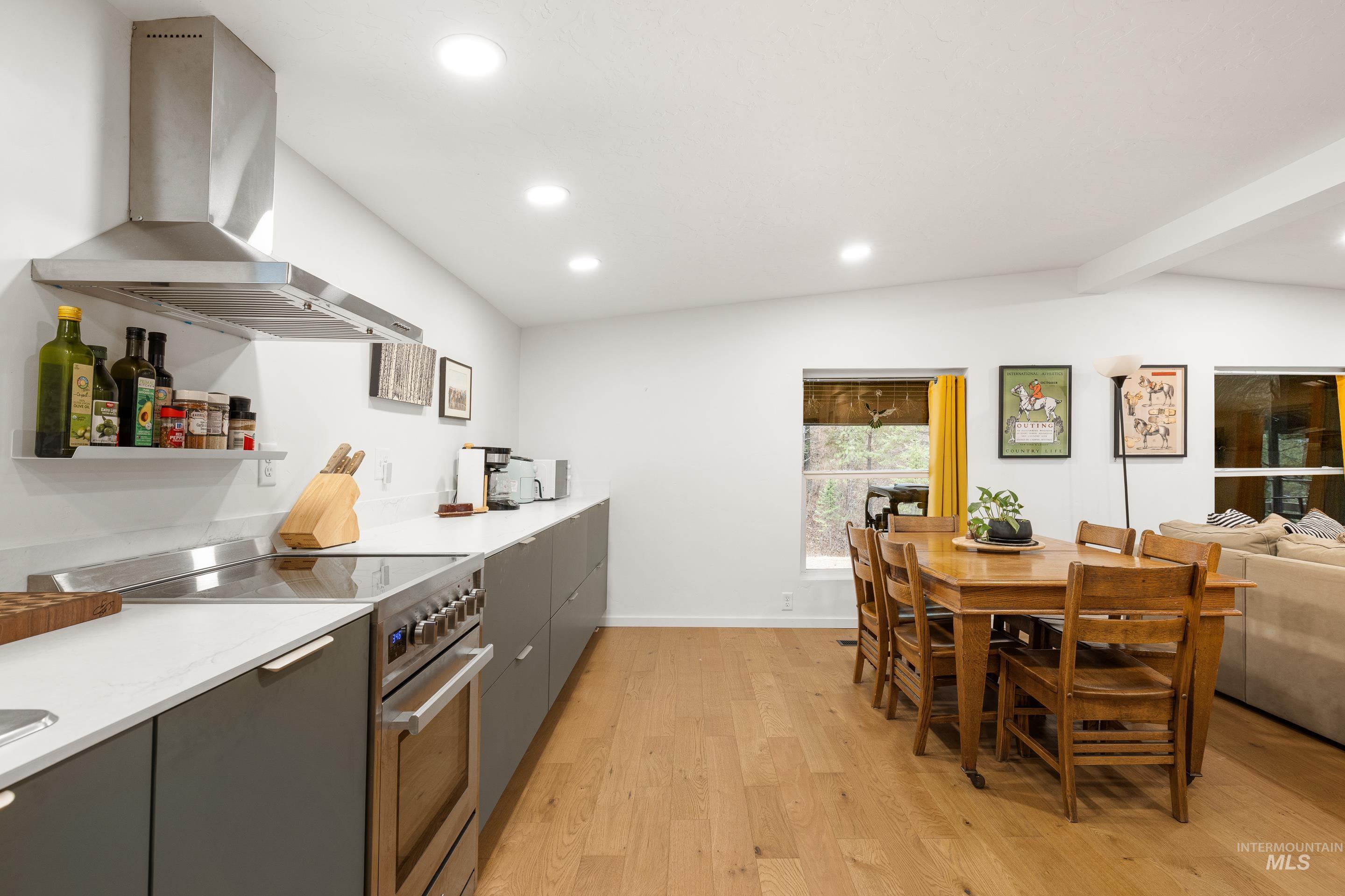 32 Sky Ridge Drive Garden Valley, ID 83622 - Photo 13 of 37 Kitchen with recessed lighting, high end stainless steel range oven, light wood-style floors, lofted ceiling with beams, and open shelves