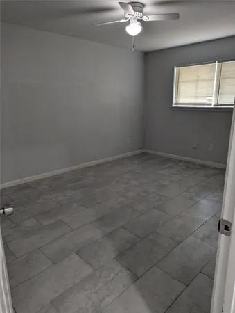 en empty room with windows