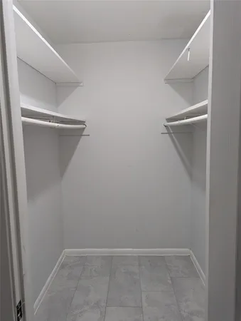 a view of an empty walk in closet