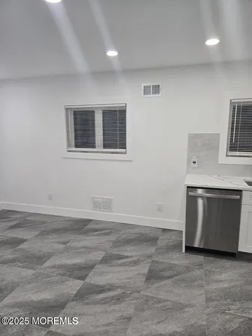 a view of an empty room with a fireplace