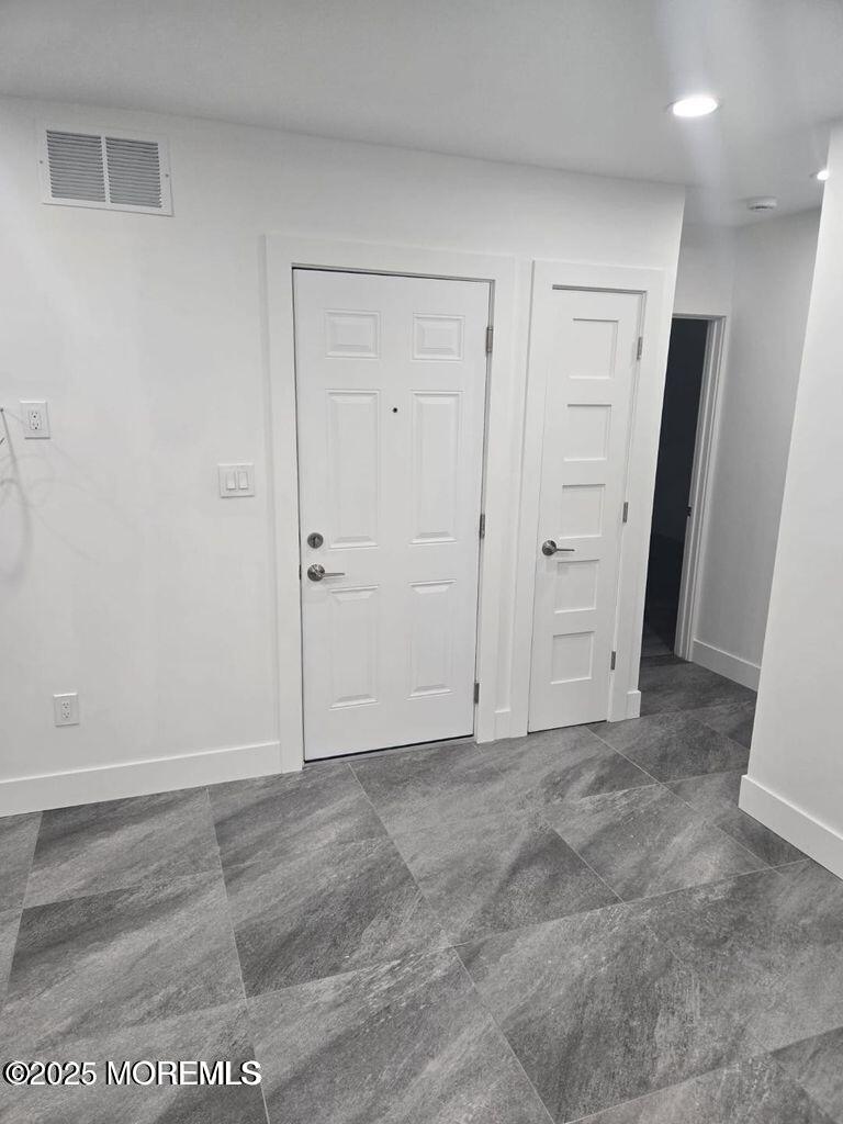 186 Coleman Avenue, Unit D Long Branch, NJ 07740 - Photo 5 of 16 an empty room with an entryway