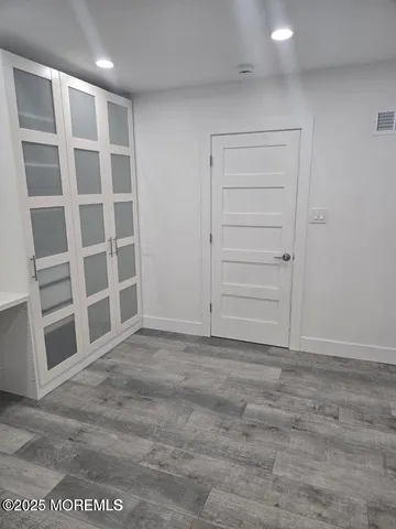 a view of an empty room with a closet