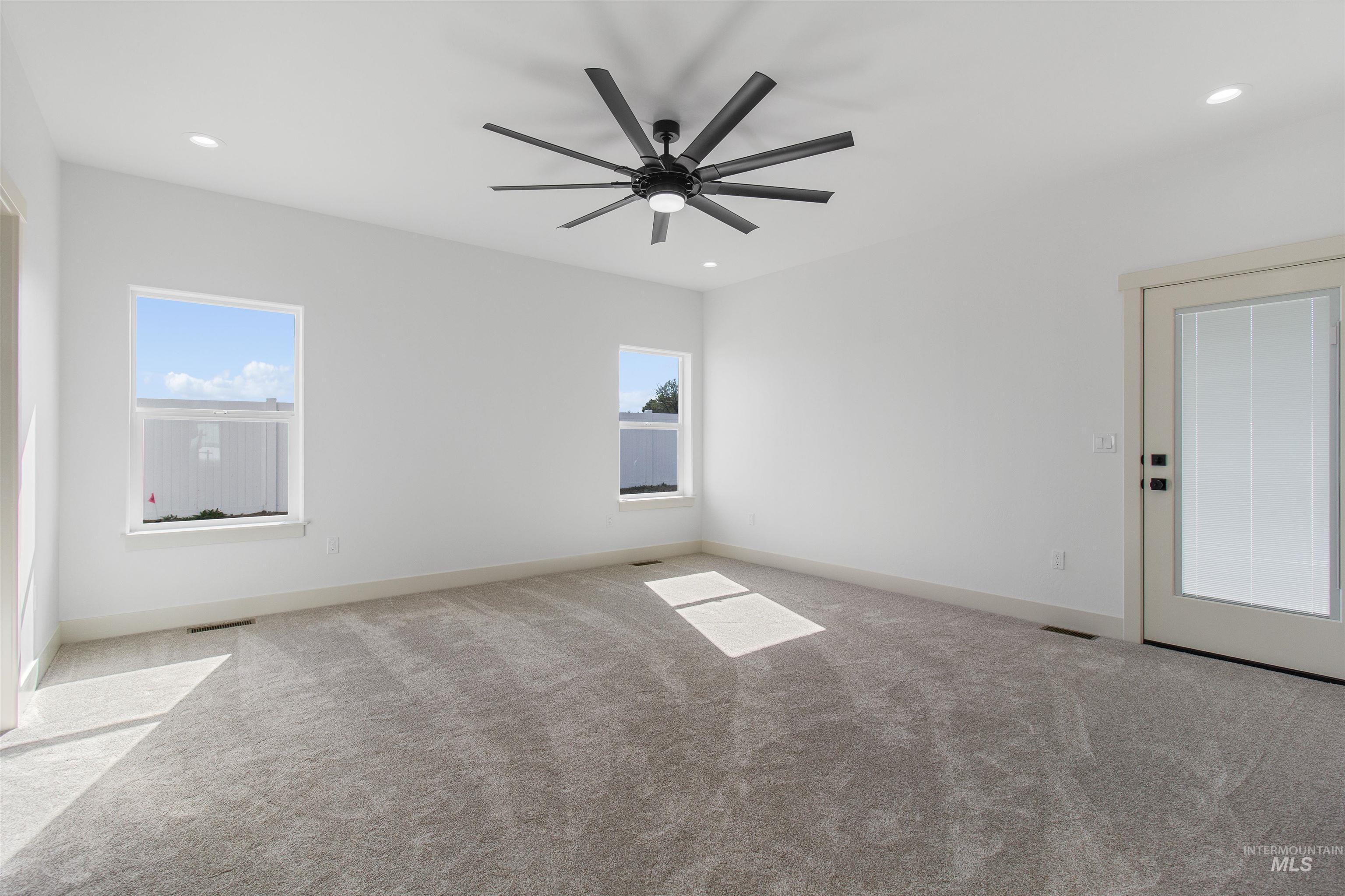 514 Full Moon Way Twin Falls, ID 83301 - Photo 17 of 49 Unfurnished room featuring light carpet, recessed lighting, and ceiling fan