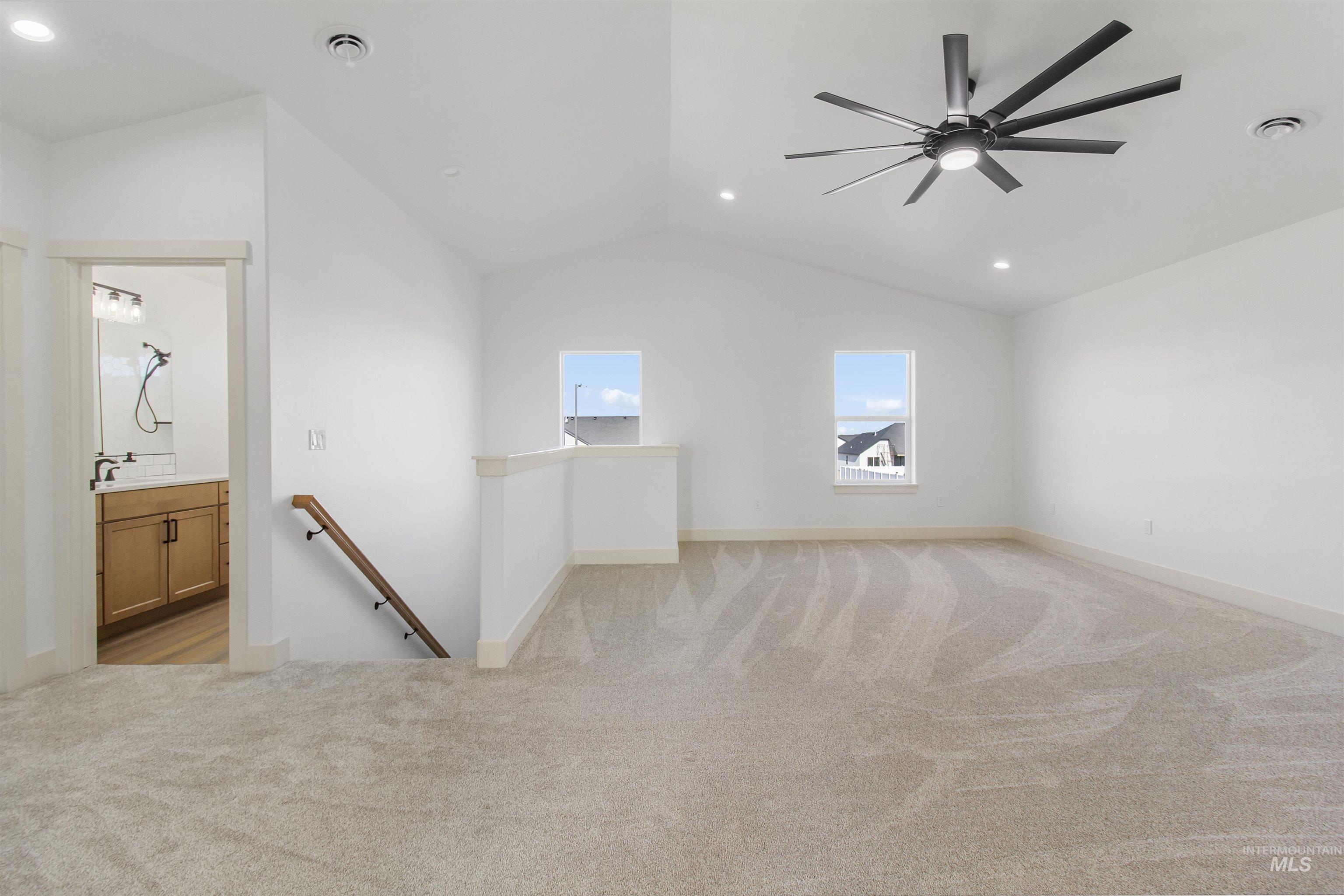 514 Full Moon Way Twin Falls, ID 83301 - Photo 28 of 49 Empty room featuring light colored carpet, recessed lighting, a ceiling fan, and lofted ceiling