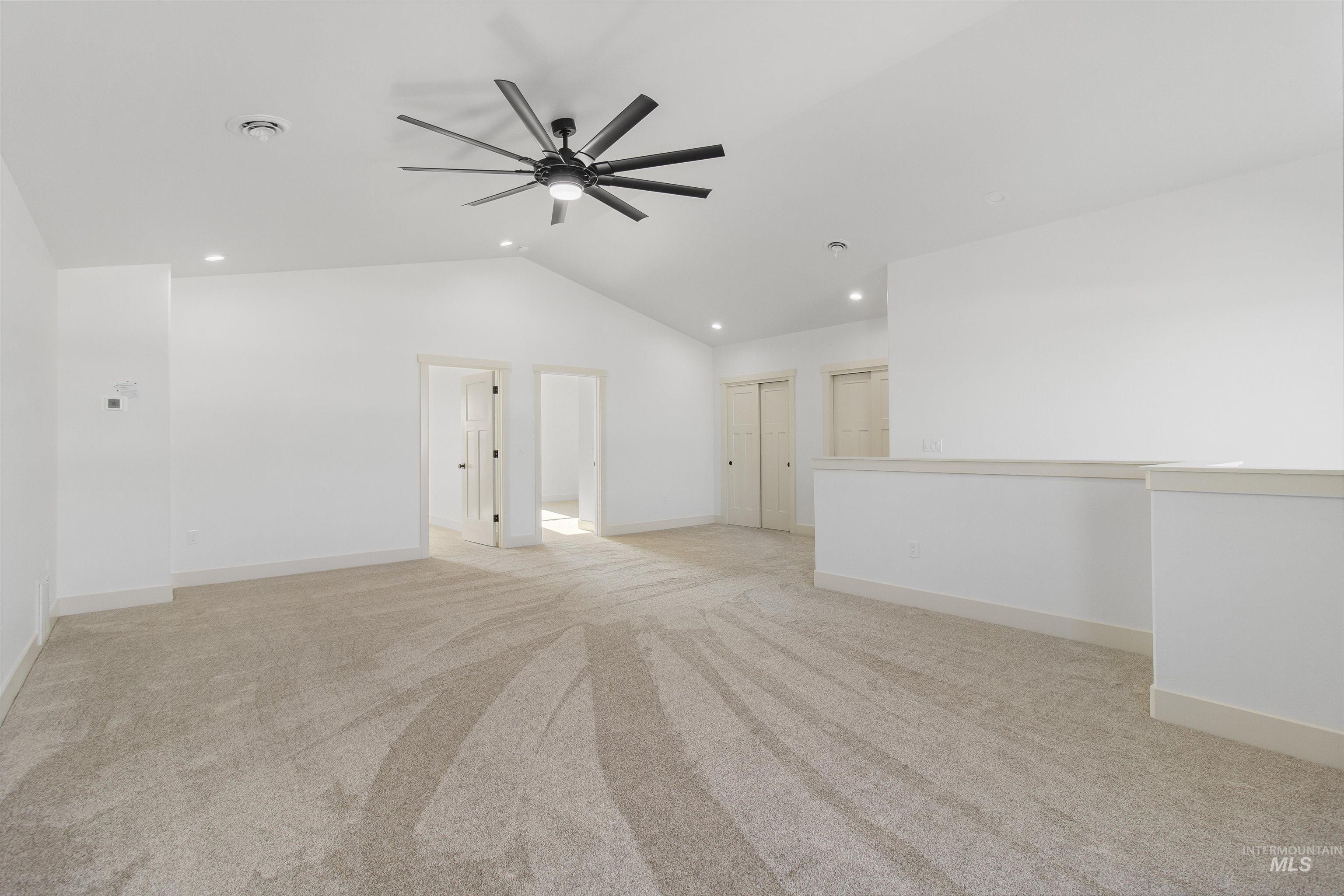514 Full Moon Way Twin Falls, ID 83301 - Photo 30 of 49 Spare room featuring light colored carpet, a ceiling fan, vaulted ceiling, and recessed lighting