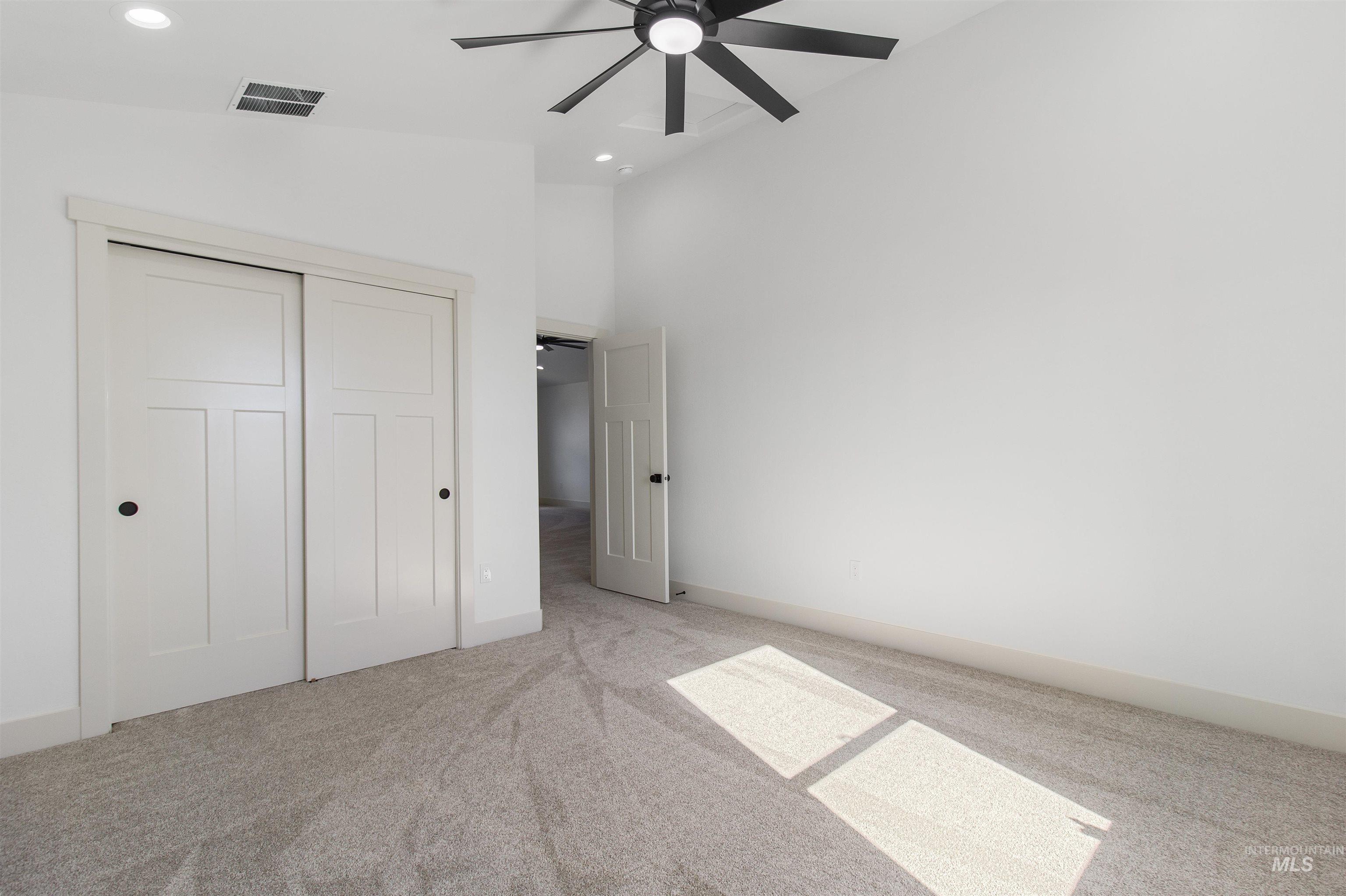 514 Full Moon Way Twin Falls, ID 83301 - Photo 33 of 49 Unfurnished bedroom featuring carpet floors, a high ceiling, a closet, and ceiling fan