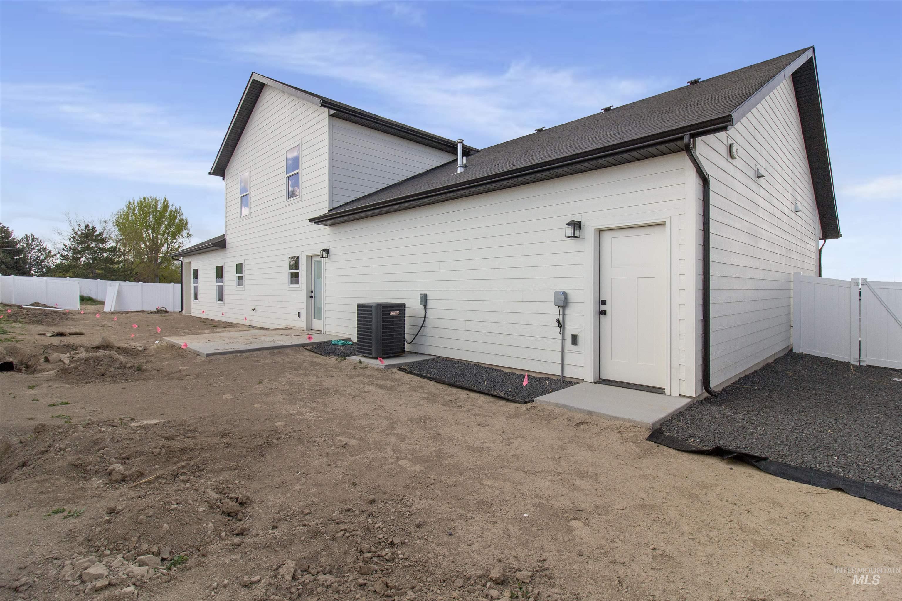 514 Full Moon Way Twin Falls, ID 83301 - Photo 42 of 49 Back of house featuring a fenced backyard, a gate, a patio, and roof with shingles