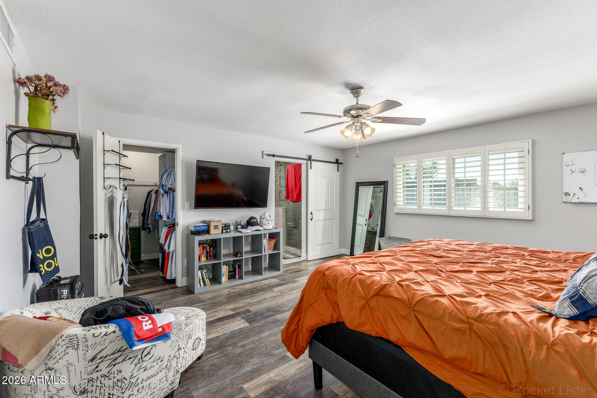 4923 North Granite Reef Road Scottsdale, AZ 85251 - Photo 11 of 28 a bedroom with a bed and a flat screen tv
