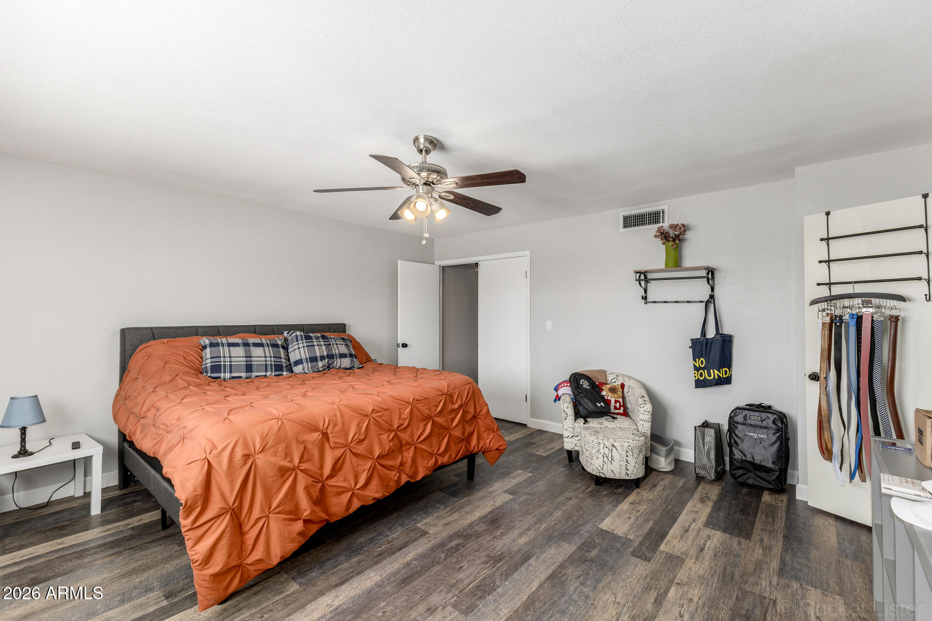 4923 North Granite Reef Road Scottsdale, AZ 85251 - Photo 12 of 28 a bedroom with a bed and wooden floor