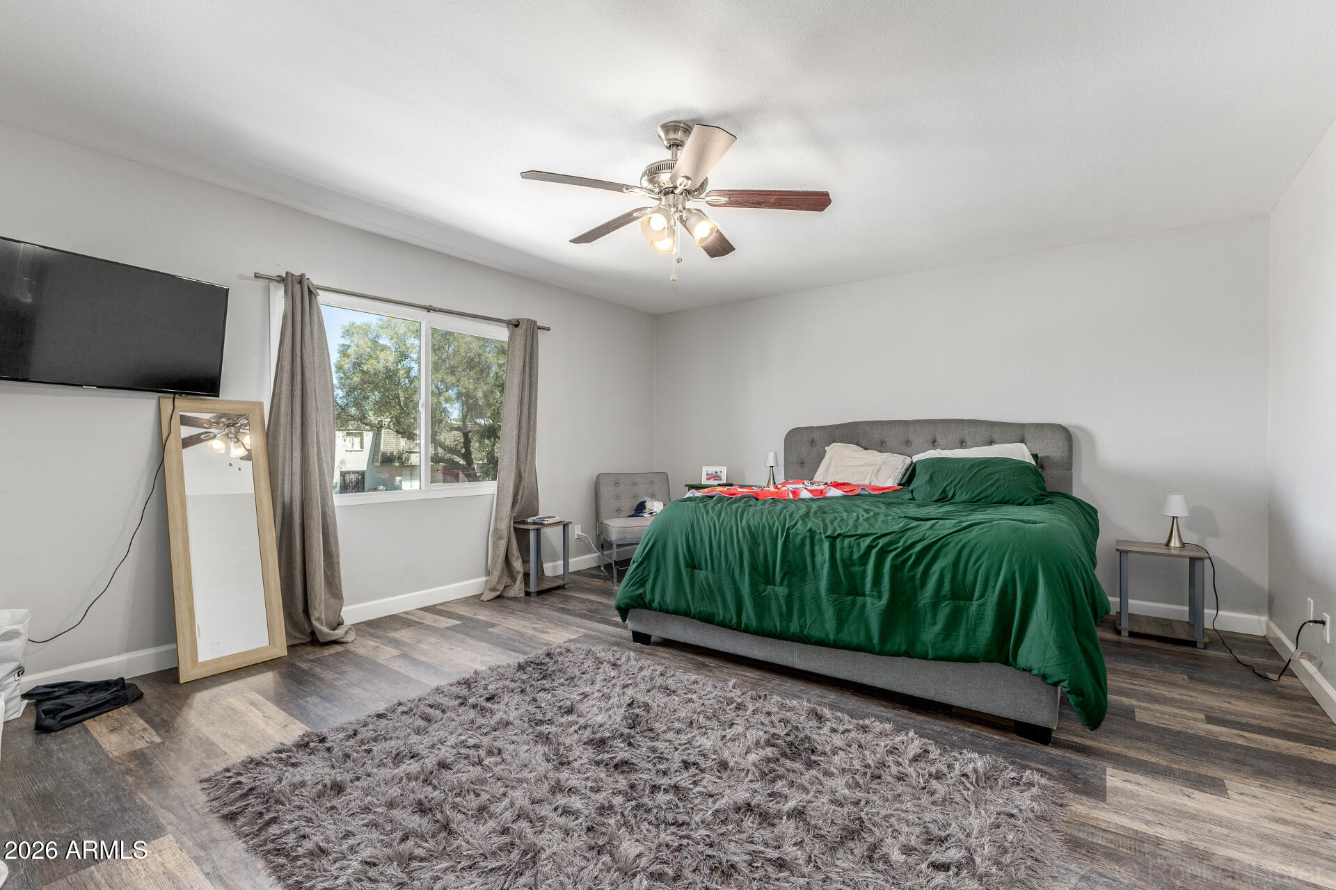 4923 North Granite Reef Road Scottsdale, AZ 85251 - Photo 15 of 28 a bedroom with a bed and a flat screen tv