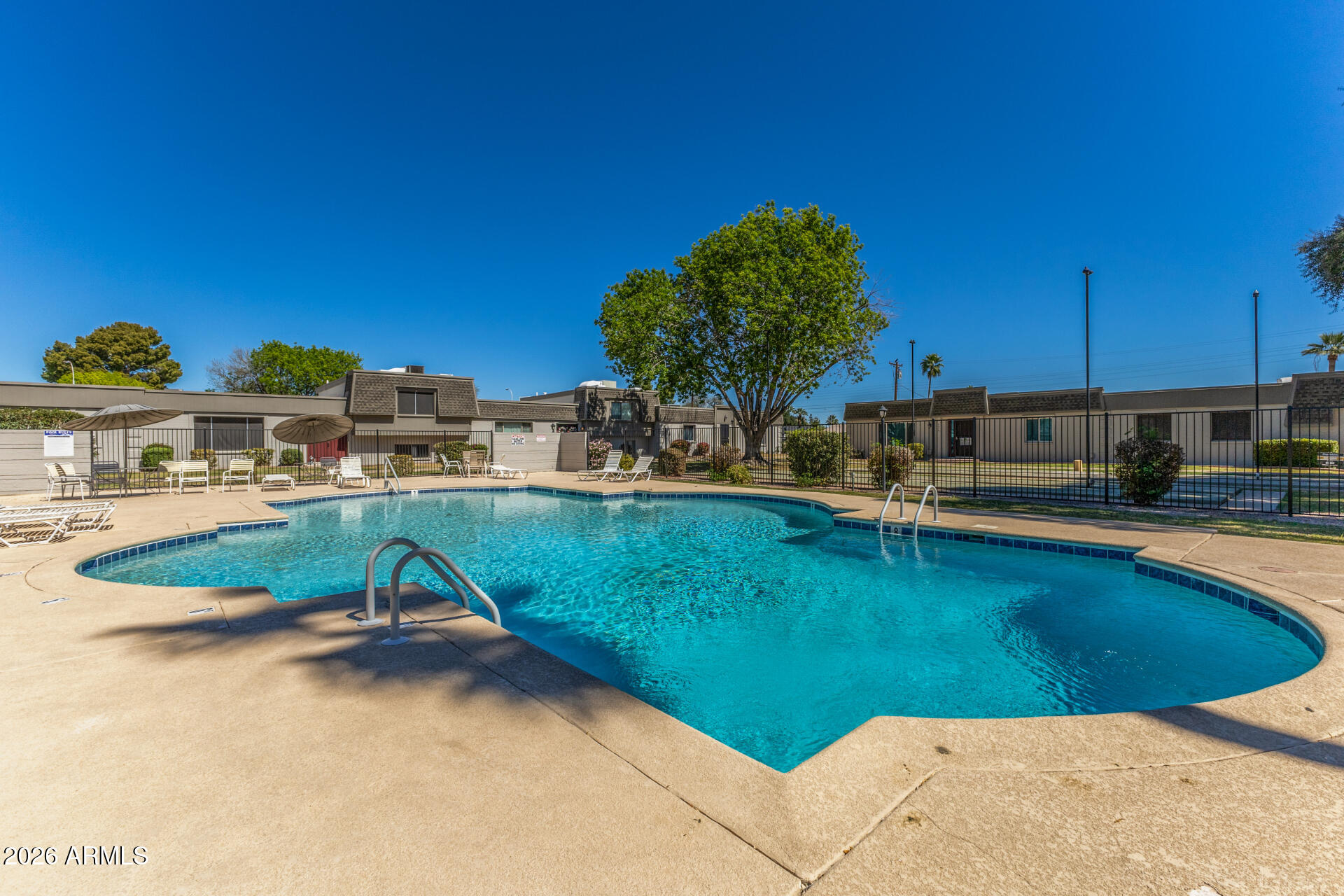 4923 North Granite Reef Road Scottsdale, AZ 85251 - Photo 26 of 28 a view of a swimming pool with a lounge chair