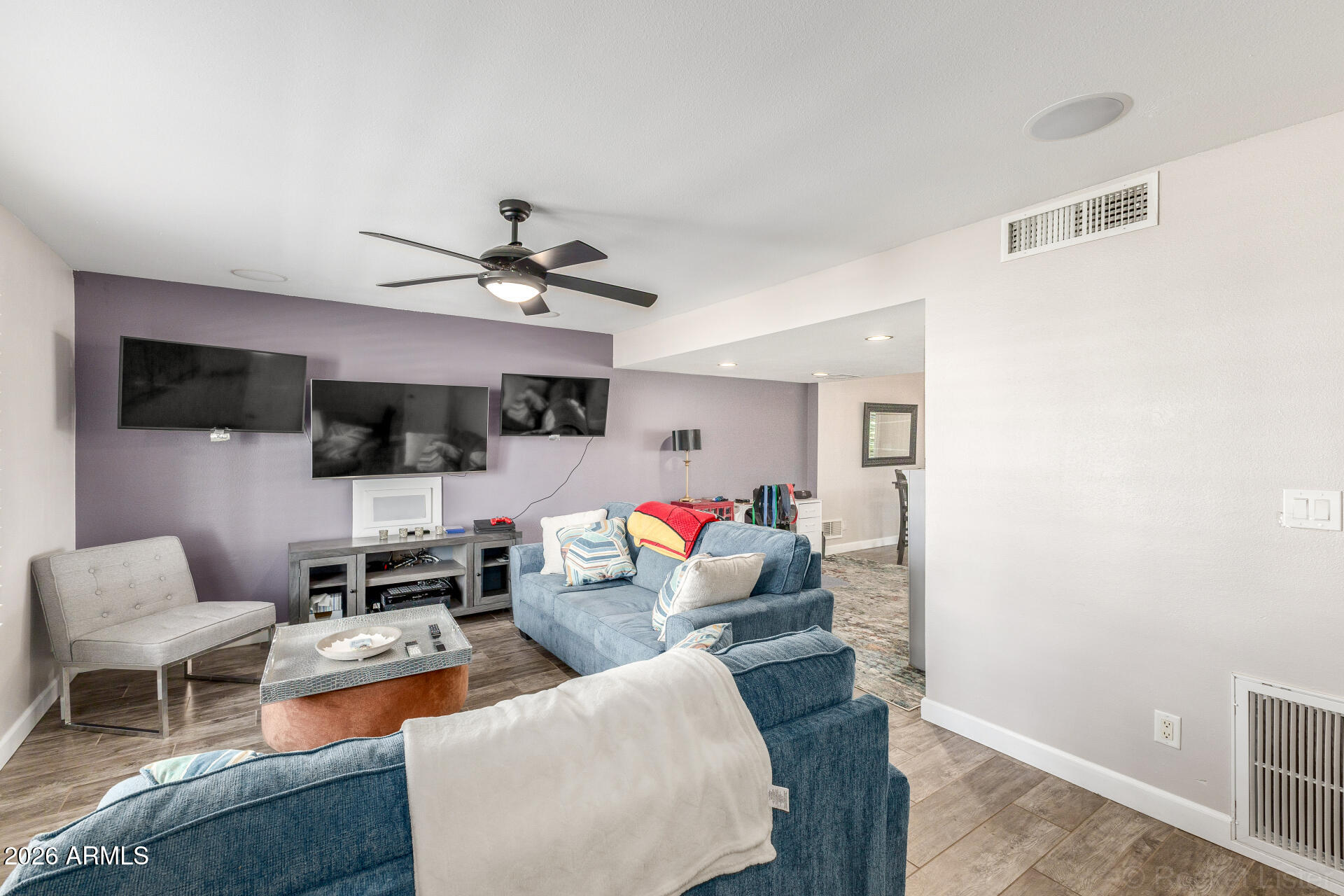 4923 North Granite Reef Road Scottsdale, AZ 85251 - Photo 3 of 28 a living room with furniture kitchen view and a flat screen tv