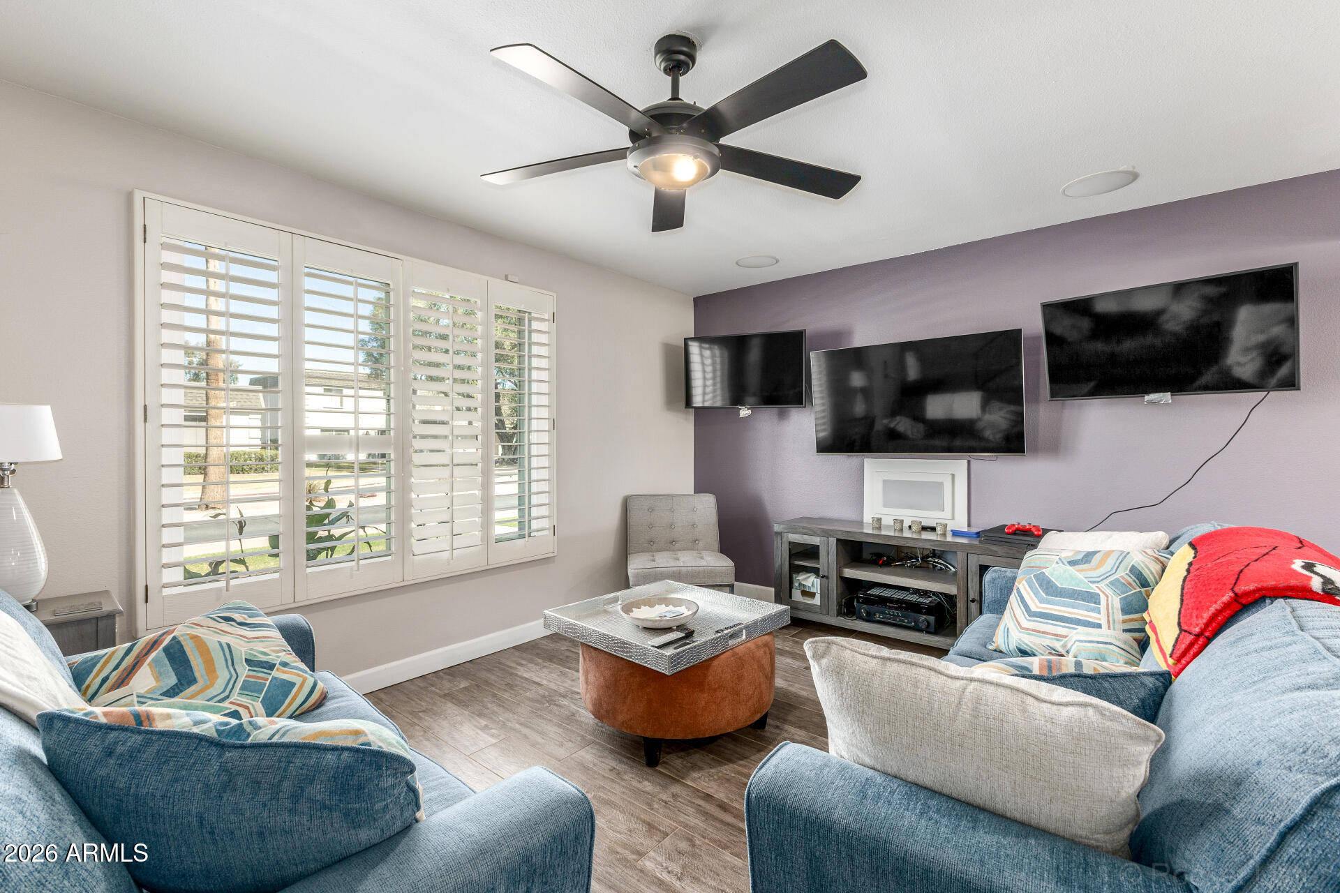 4923 North Granite Reef Road Scottsdale, AZ 85251 - Photo 4 of 28 a living room with furniture and a flat screen tv