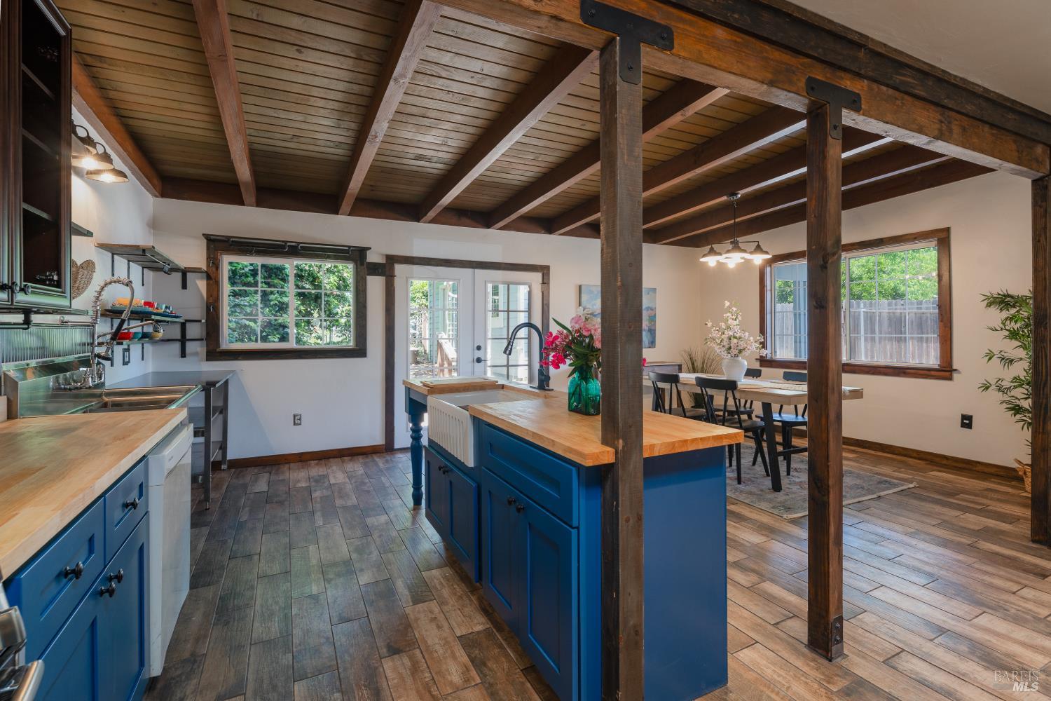 262 Magnolia Street Ukiah, CA 95482 - Photo 10 of 34 a kitchen with stainless steel appliances granite countertop wooden floors and sink