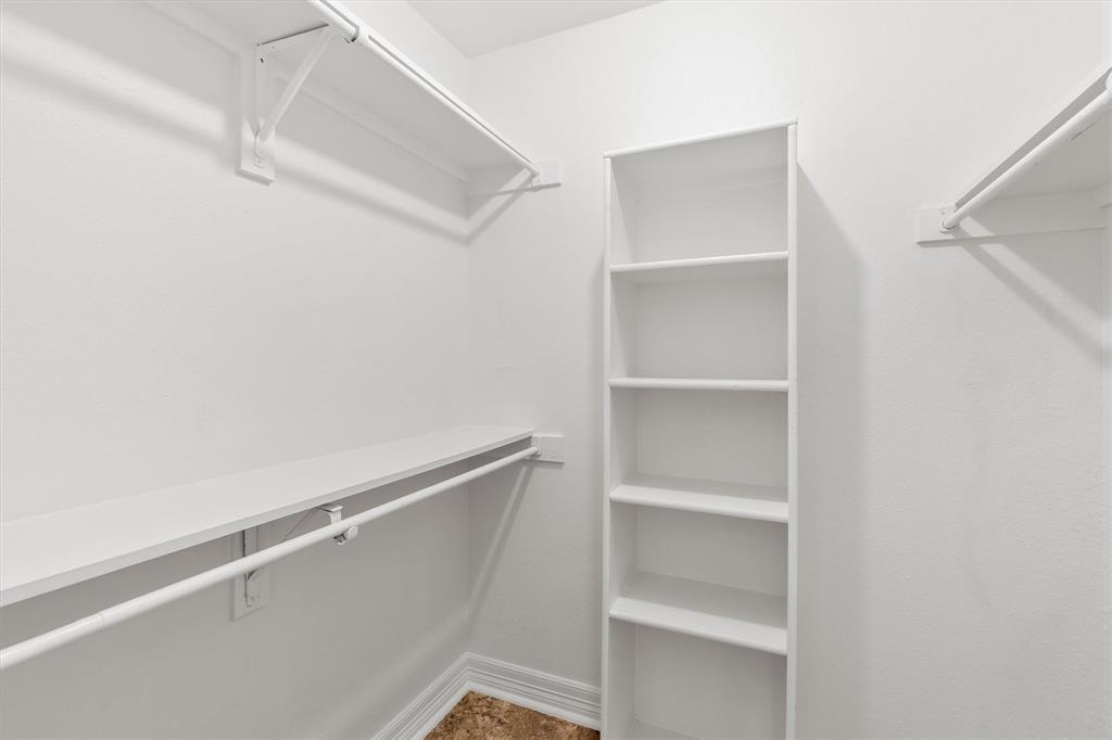 5565 Preston Oaks Road, Unit 136 Dallas, TX 75254 - Photo 29 of 40 a view of an empty walk in closet