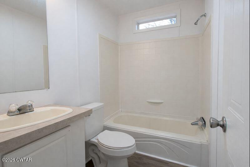 308 Broadway Street Obion, TN 38240 - Photo 12 of 16 a bathroom with a sink toilet and shower