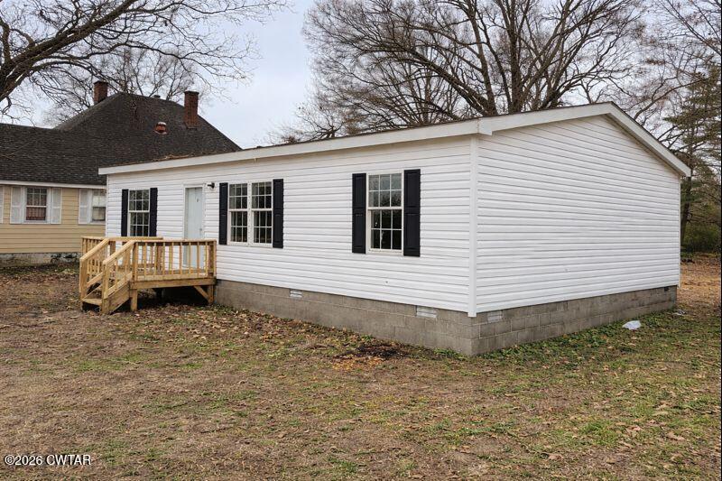 308 Broadway Street Obion, TN 38240 - Photo 14 of 16 a front view of a house with a yard