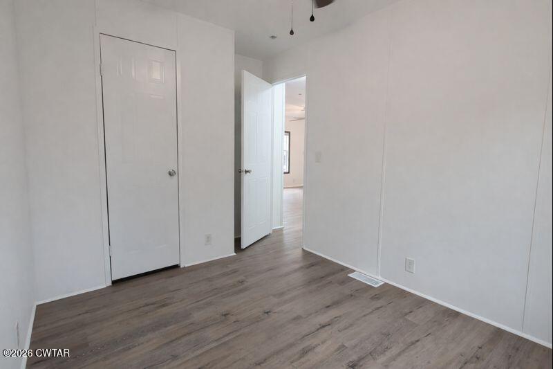 308 Broadway Street Obion, TN 38240 - Photo 10 of 16 a view of an empty room with wooden floor
