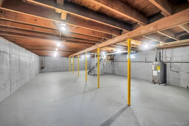 a view of an empty room with wooden roof