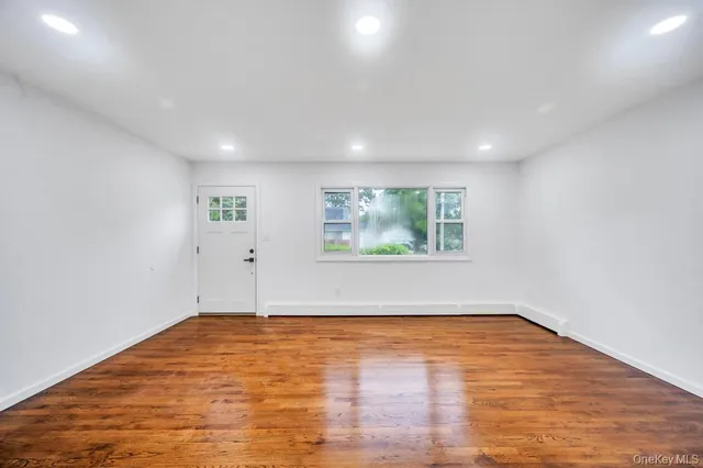 a kitchen with refrigerator and cabinets