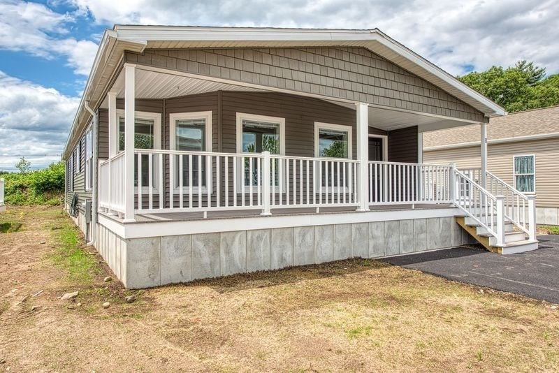 a front view of a house with a wooden fence