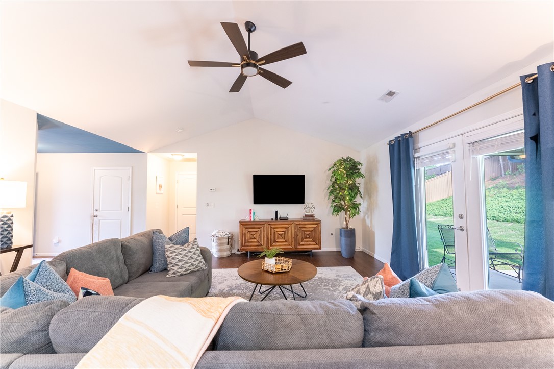 1012 Whirlaway Circle Anderson, SC 29621 - Photo 5 of 25 A spacious living area features high vaulted ceilings and direct access to the outdoors through sliding glass doors.