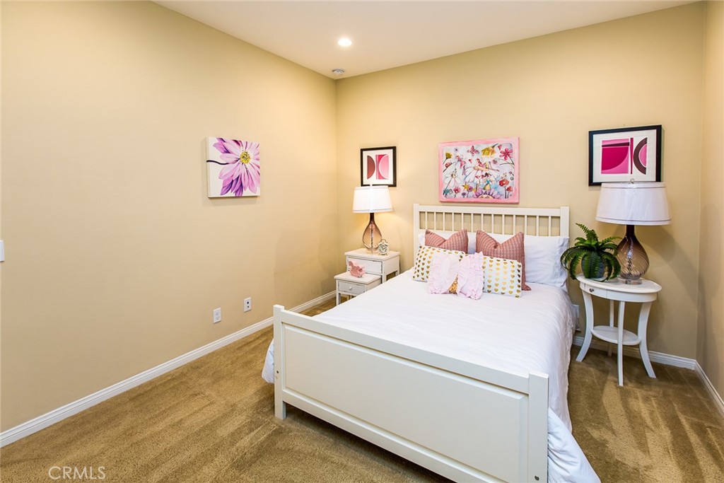 75 Gardenstone Path Irvine, CA 92620 - Photo 25 of 65 a bed room with a bed and a chair