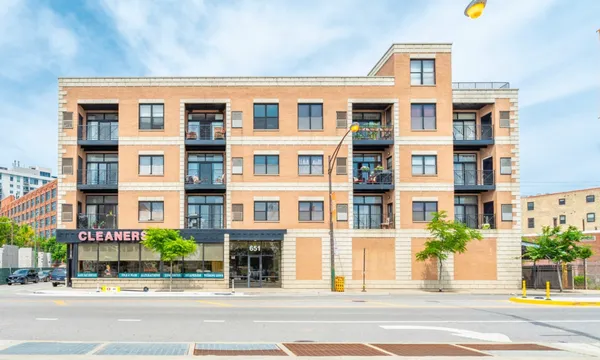 a front view of a building with street view