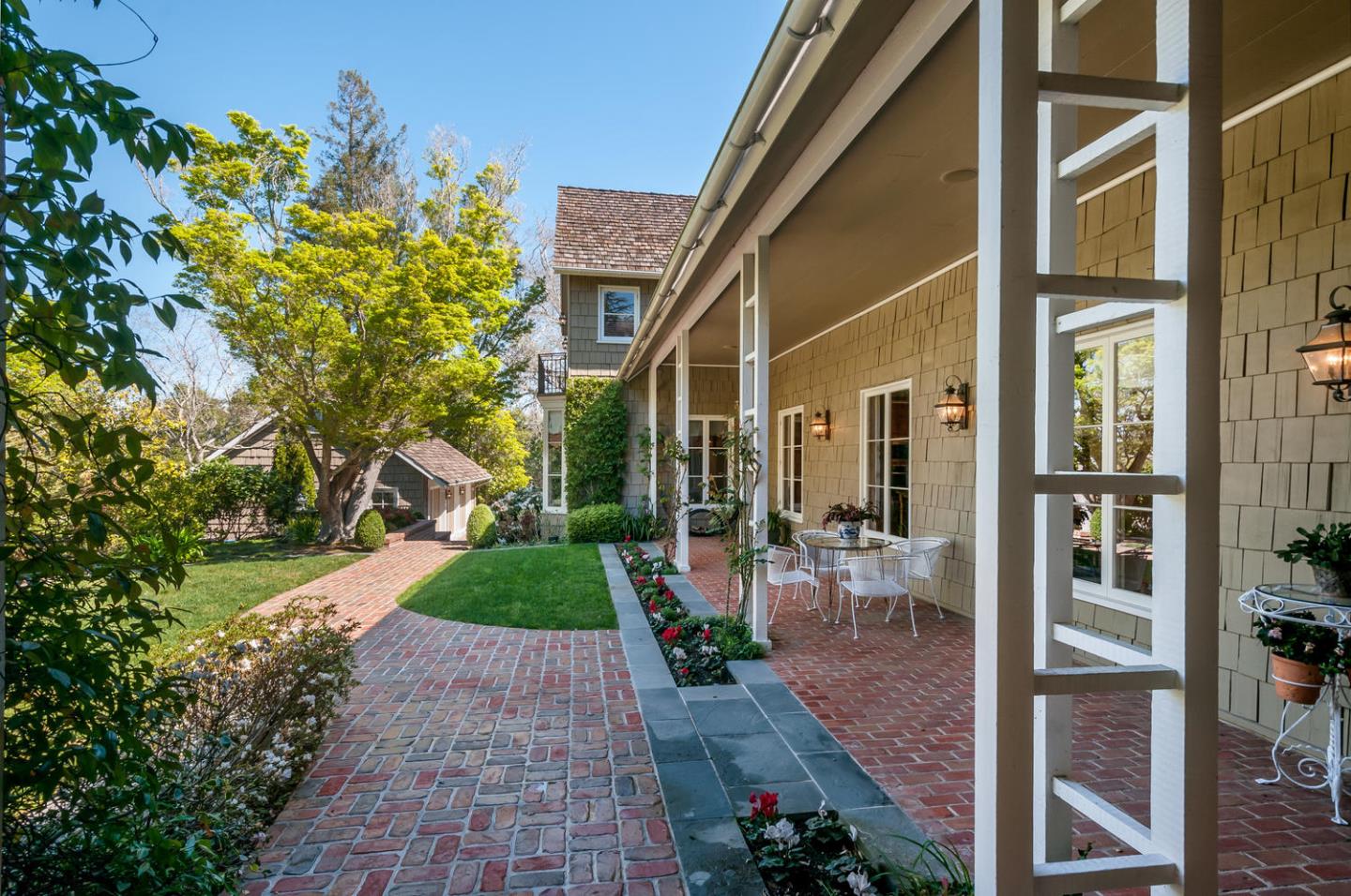 989 Hayne Road Hillsborough, CA 94010 - Photo 18 of 100 a view of a porch with chairs and potted plants