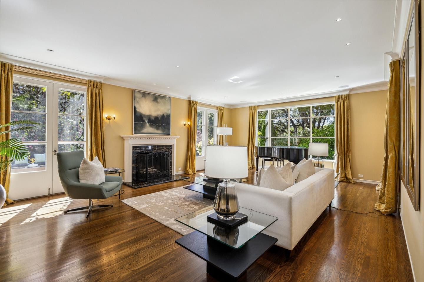 989 Hayne Road Hillsborough, CA 94010 - Photo 21 of 100 a living room with furniture fireplace and a large window