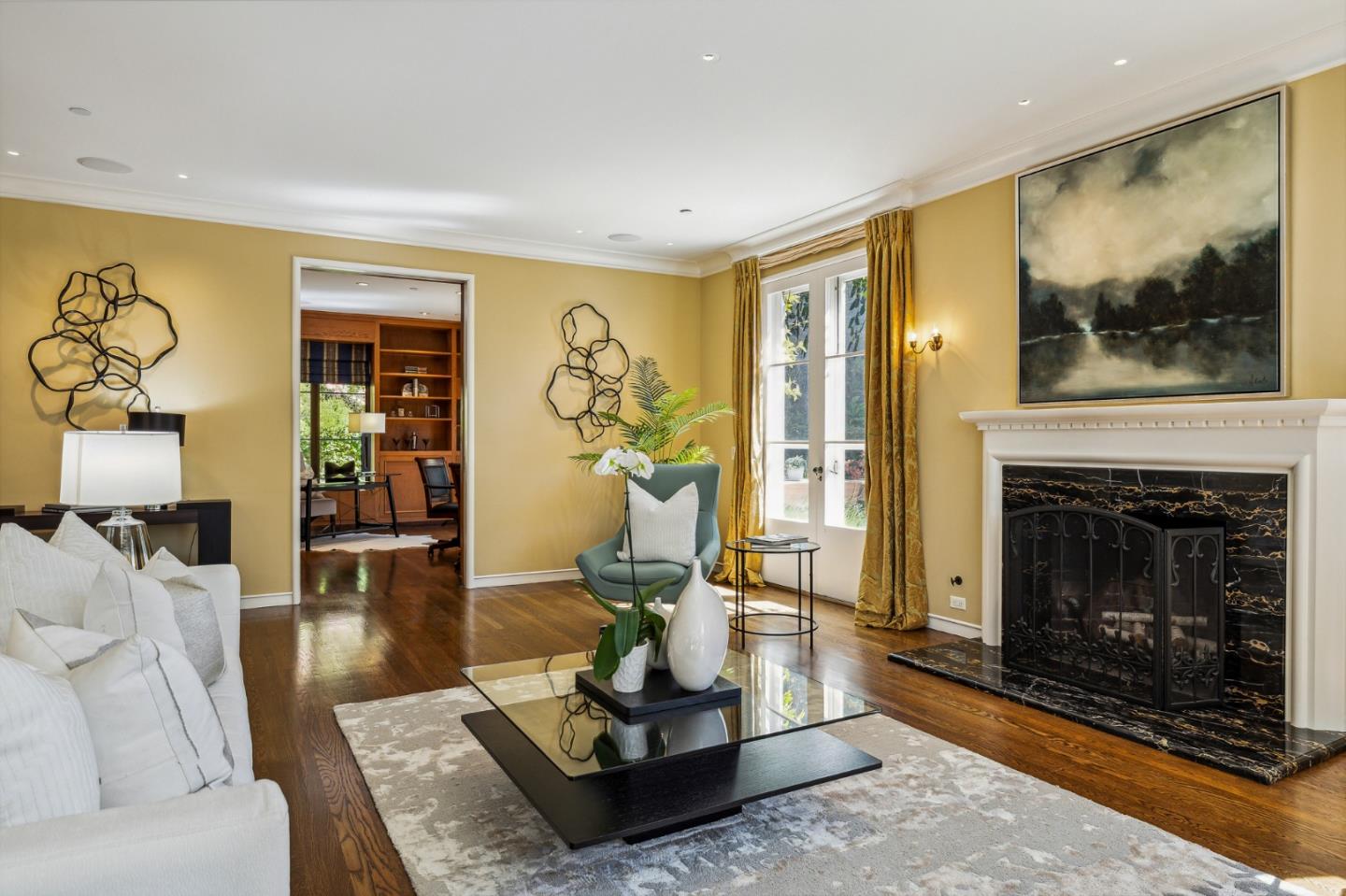 989 Hayne Road Hillsborough, CA 94010 - Photo 24 of 100 a living room with furniture a flat screen tv and a fireplace