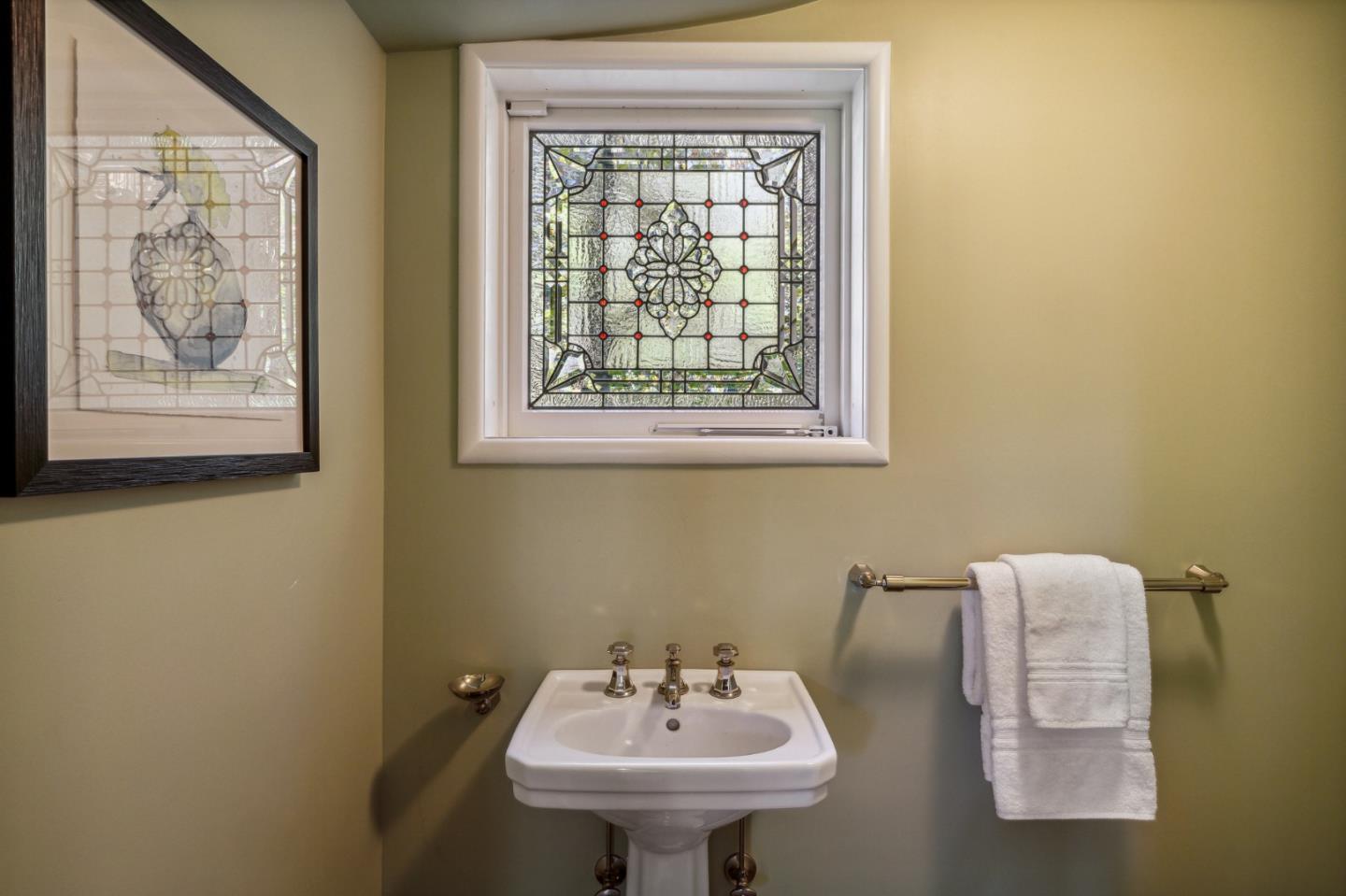 989 Hayne Road Hillsborough, CA 94010 - Photo 30 of 100 a bathroom with a sink a mirror and a window