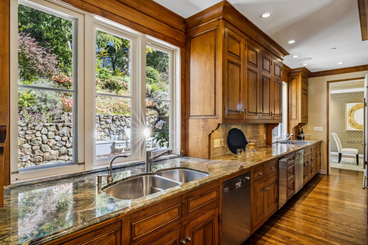 989 Hayne Road Hillsborough, CA 94010 - Photo 38 of 100 a kitchen with kitchen island granite countertop a sink and a large window