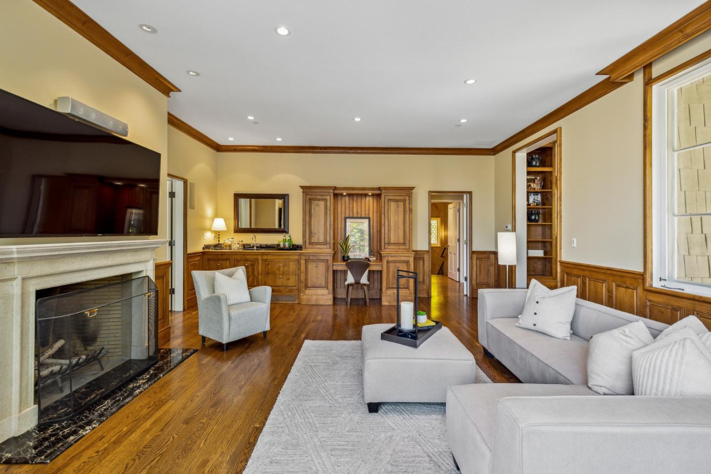 989 Hayne Road Hillsborough, CA 94010 - Photo 44 of 100 a living room with furniture fireplace and flat screen tv