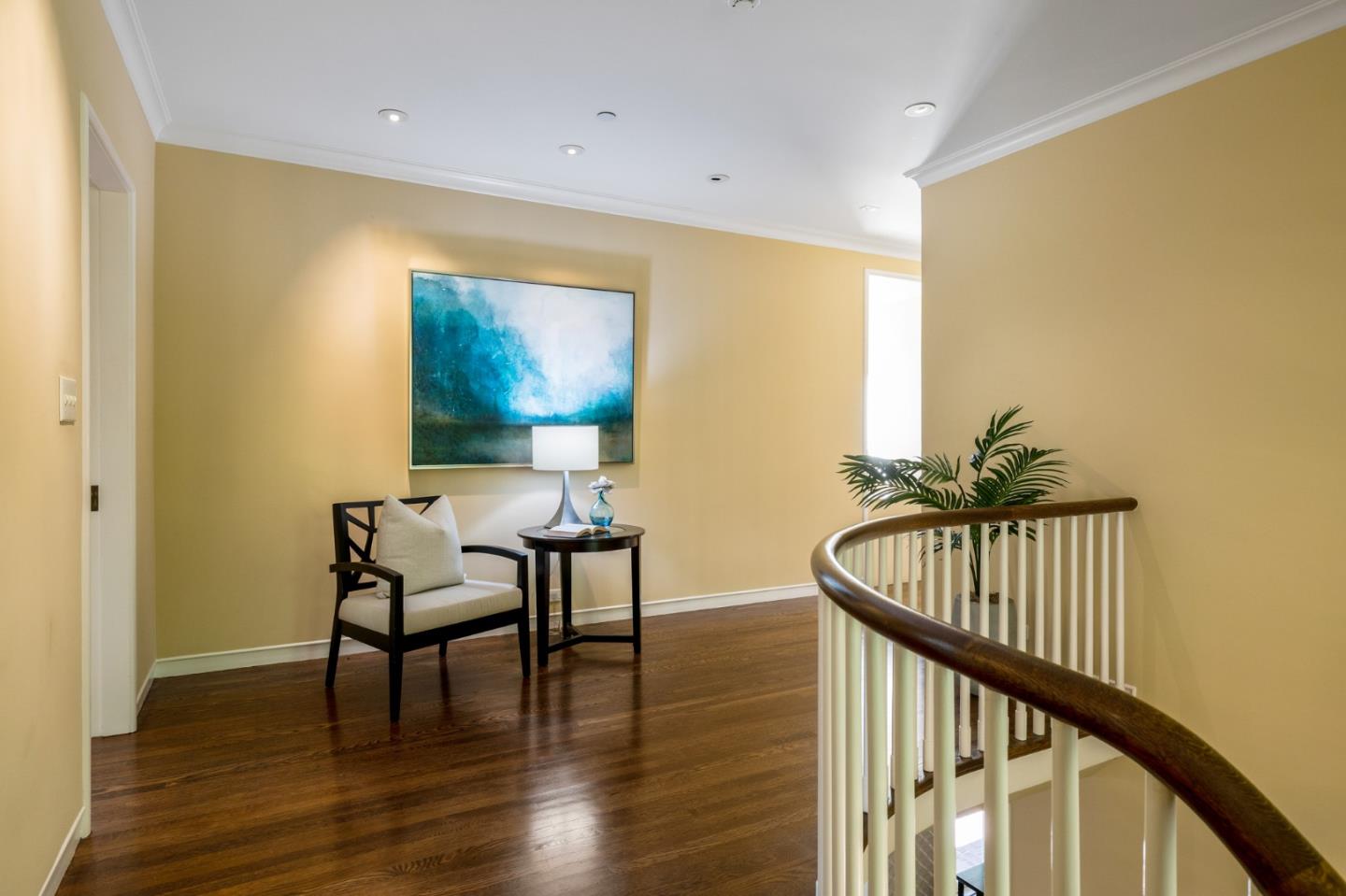 989 Hayne Road Hillsborough, CA 94010 - Photo 59 of 100 a view of a hallway with wooden floor and a potted plant