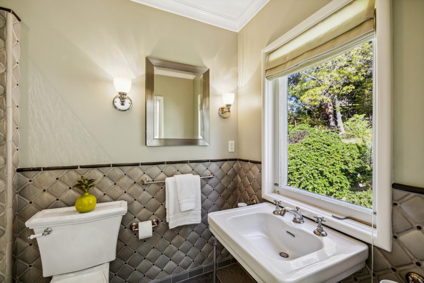 989 Hayne Road Hillsborough, CA 94010 - Photo 63 of 100 a bathroom with a sink and a mirror