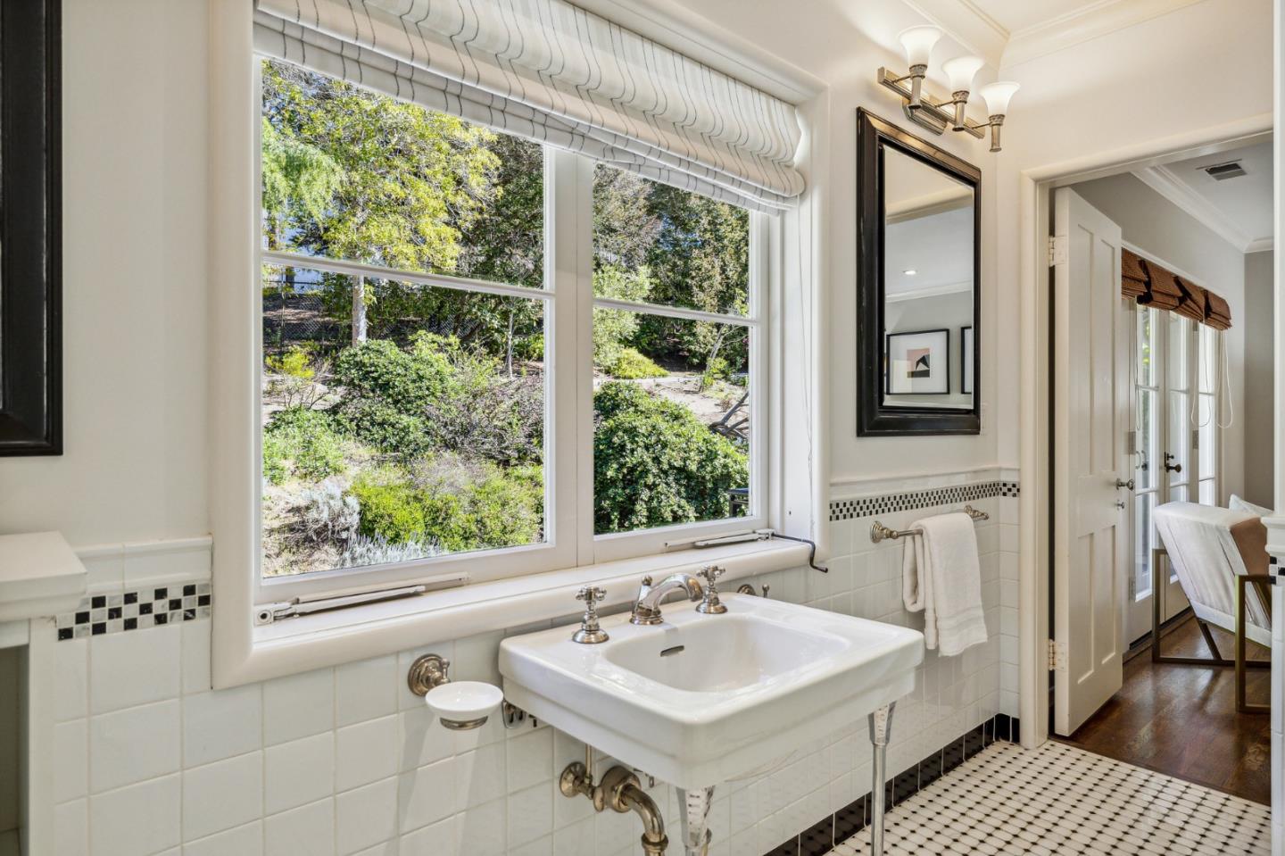 989 Hayne Road Hillsborough, CA 94010 - Photo 73 of 100 a bathroom with a sink a toilet and a mirror