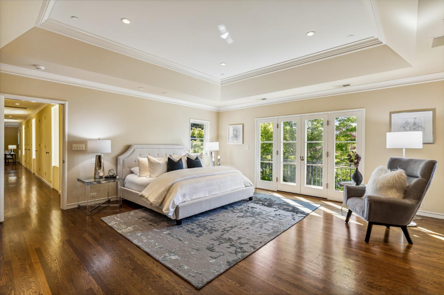 989 Hayne Road Hillsborough, CA 94010 - Photo 75 of 100 a spacious bedroom with a bed and wooden floor