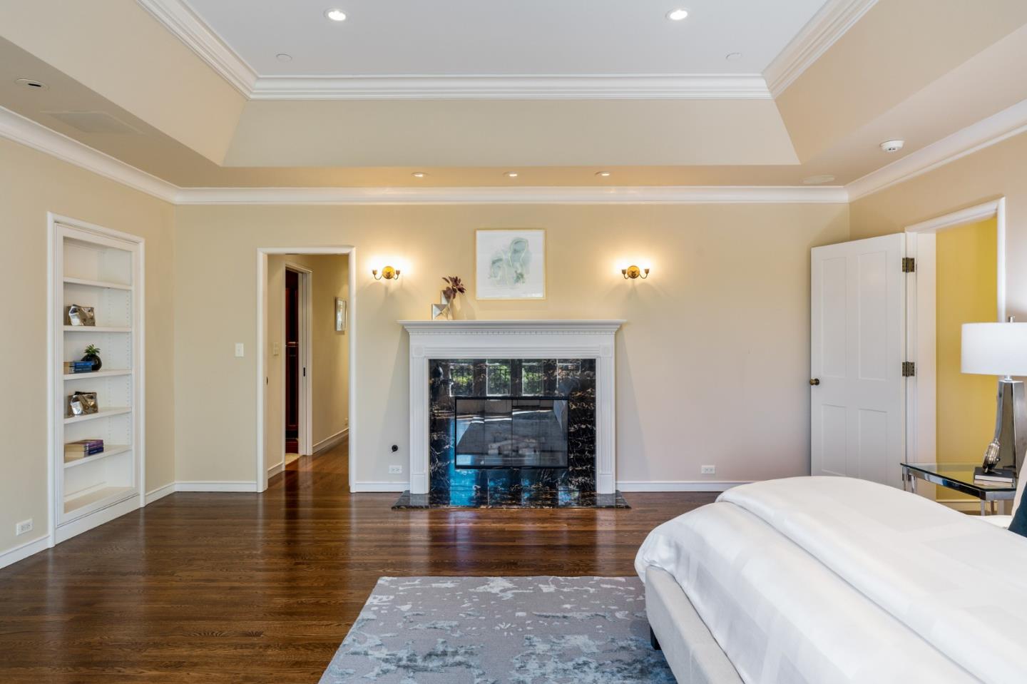 989 Hayne Road Hillsborough, CA 94010 - Photo 77 of 100 a spacious bedroom with a bed and a flat screen tv