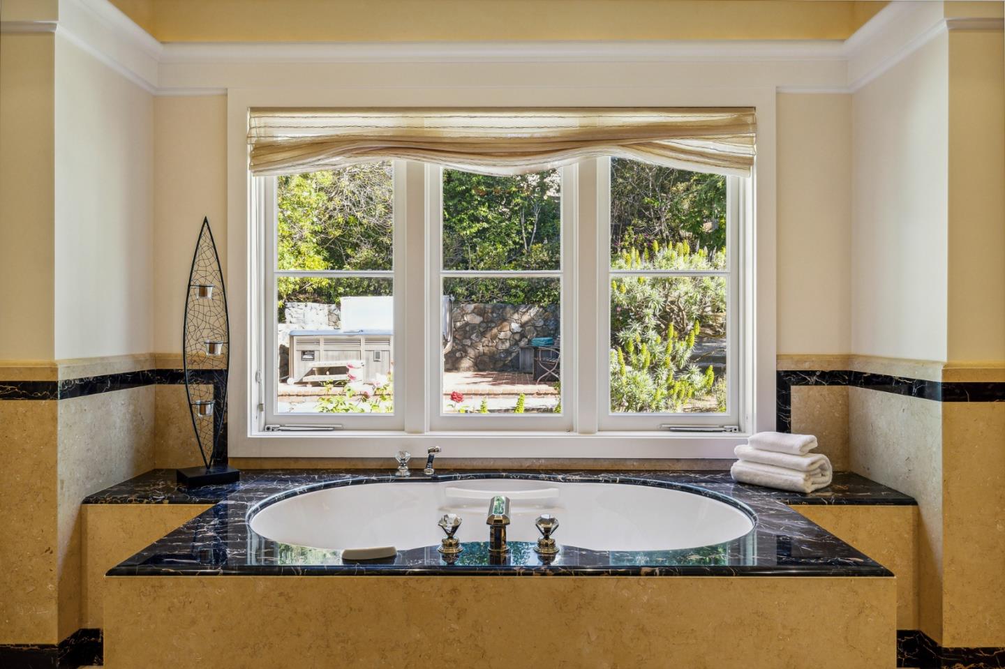 989 Hayne Road Hillsborough, CA 94010 - Photo 86 of 100 a bath tub sitting in a bathroom next to a window