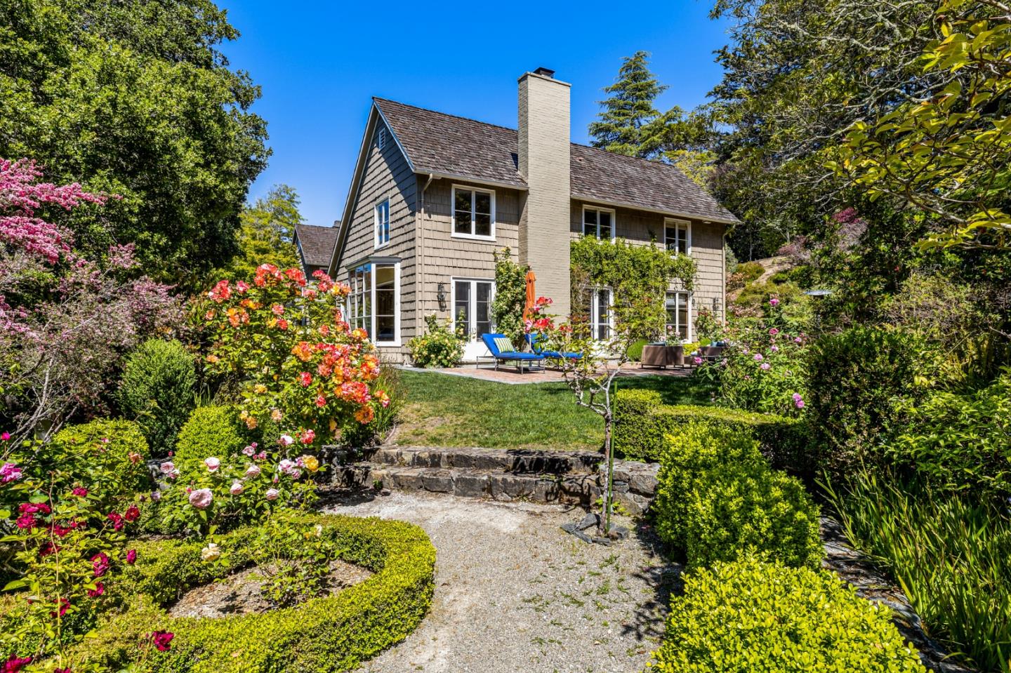 989 Hayne Road Hillsborough, CA 94010 - Photo 93 of 100 a front view of a house with a yard and fountain