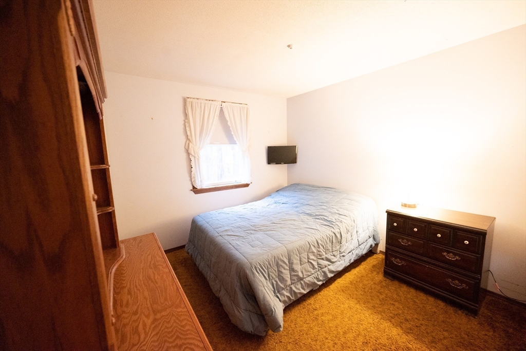 59 Squannacook Road Shirley, MA 01464 - Photo 16 of 37 a bedroom with a bed and a window