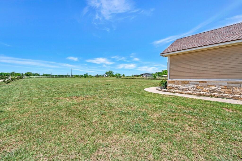 355 Highway 236 Moody, TX 76557 - Photo 6 of 36 View of green lawn featuring a view of rural / pastoral area