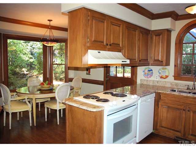 Beautiful kitchen with large breakfast nook, opens to the back and side yard.  Kitchen features new granite counters, stainless steel sink and hardwood floors!