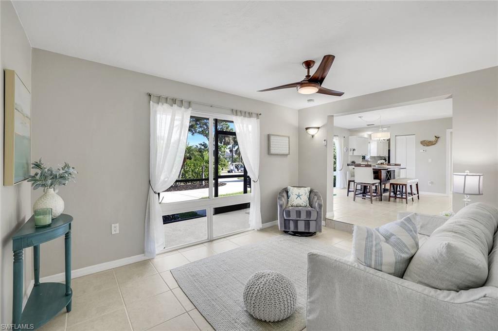 1237 Jamaica Road Marco Island, FL 34145 - Photo 12 of 26 a living room with furniture and a large window