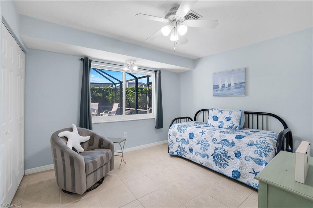 1237 Jamaica Road Marco Island, FL 34145 - Photo 17 of 26 a living room with furniture and a large window