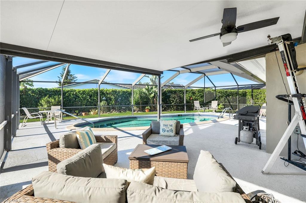 1237 Jamaica Road Marco Island, FL 34145 - Photo 21 of 26 a living room with furniture and a floor to ceiling window